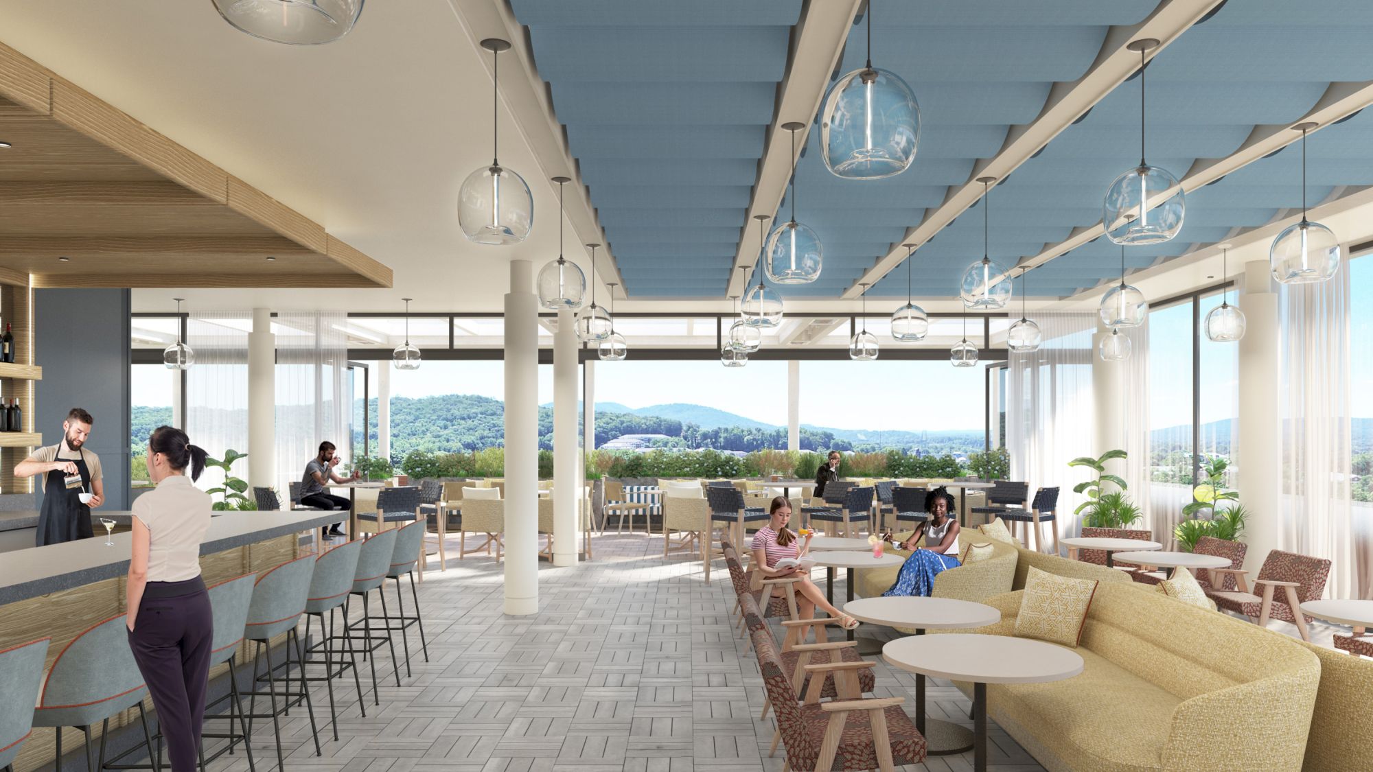 The image shows a modern cafe with a bar, seating areas, and large windows offering a view of hills and greenery.