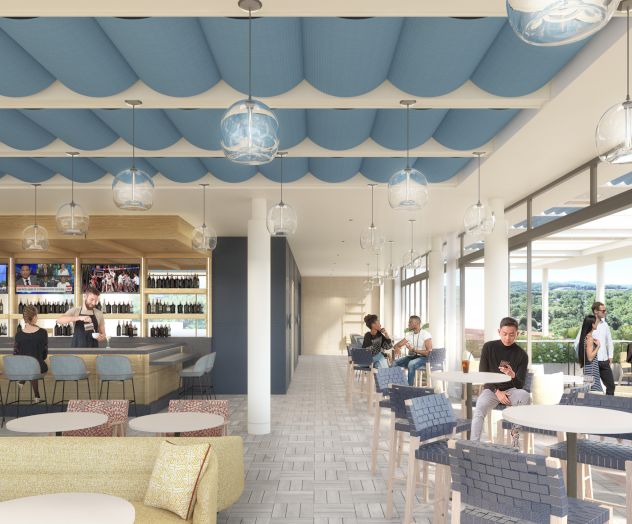 A modern bar with people seated at tables, a bartender serving drinks, a scenic view through large windows, and a blue wave-patterned ceiling.