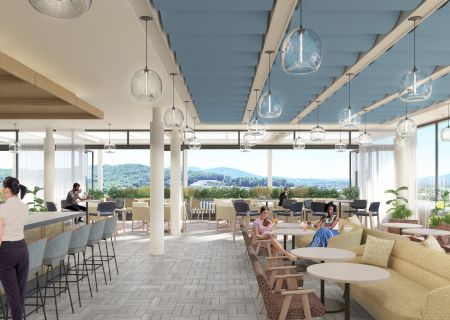 A modern café with people sitting and enjoying drinks, featuring large windows with a view of a scenic landscape and stylish lighting.