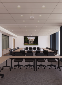 The image shows a modern conference room with long tables, black chairs, and a large screen displaying a building in the background.